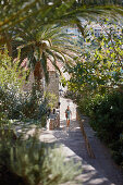 Woman at stairs to the Piazza, Aman Sveti Stefan, Sveti Stefan, Budva, Montenegro