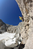 Woman ascending from glacier Hoellentalferner to fixed rope route to Zugspitze, Wetterstein mountain range, Upper Bavaria, Bavaria, Germany