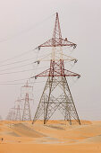 Electricity pylons in dessert, Abu Dhabi, United Arab Emirates