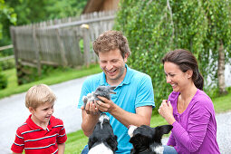 Family with a rabbit and dogs, Styria, Austria