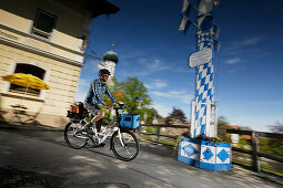 Man cycling an E-bike, Munsing, Upper Bavaria, Germany
