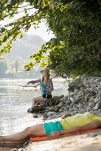 Two young women at river Rhine, Rheinfelden, Baden-Wuerttemberg, Germany