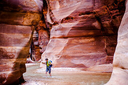 Woman hiking through a gorge, Wadi Mujib, Jordan, Middle East