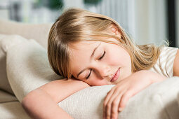 Girl sleeping on a sofa, Hamburg, Germany