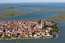 Aerial view of the Venetian Lagoon with salt marshes, Island of Burano, Fishing village with colourful house facades, Veneto, Italy