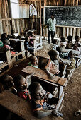 Children and teacher in a Massai village school, Kenya, Africa