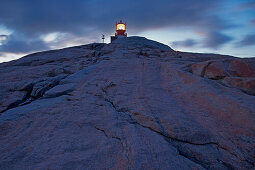 Lighthouse on rocks at Kap Lindesnes, Province of Vest-Agder, Soerlandet, Norway, Europe