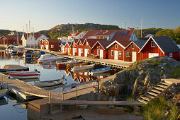 Boats and boot houses in Bleket port, Tjoern Island, Province of Bohuslaen, West coast, Sweden, Europe