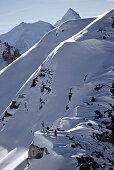Three freeskiers ascending, Chandolin, Canton of Valais, Switzerland