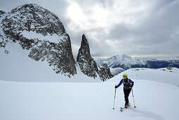 Female back-country skier ascending to Cima Cece, Lagorai, Fiemme Mountains, Trention, Italy