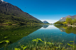 Reflection of mountains in a lake, Lago di Piano, near Porlezza, Province of Como, Lombardy, Italia