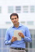 Businessman with tablet in business center. San Sebastian Technology Park. Donostia. Gipuzkoa. Basque Country. Spain.