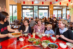 Women in a Chinese restaurant, Leipzig, Saxony, Germany