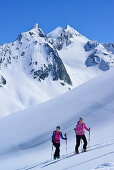 Two female back-country skiers ascending to Eiskoegele, Obergurgl, Oetztal Alps, Tyrol, Austria