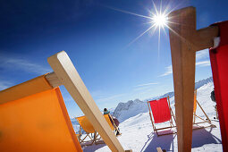 Deck chairs in snow, Zugspitze, Upper Bavaria, Germany