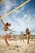 Women playing beach volleyball near the Water Sports Centre, Martinhal Beach, Sagres, Algarve, Portugal, southernmost region of mainland Europe