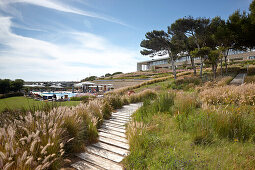 Wooden boardwalk to Martinhal Beach Resort & Hotel, Sagres, Algarve, Portugal, southernmost region of mainland Europe