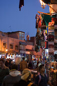 lively scene in the souk at night, Marrakech, Morocco