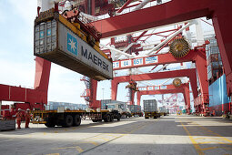 Loading of container on a truck at harbor, Port of Tianjin, Tianjin, China