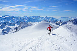 Female back-country skier ascending to Grossvenediger, Venediger Group, High Tauern National Park, Salzburg, Austria