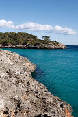Rocky coastline of Cala Mondrago bay in Parc Natural de Mondrago, near Portopetro, Mallorca, Balearic Islands, Spain