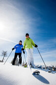 Couple skiing, Fageralm, Salzburg, Austria