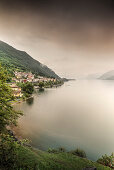 Steep coast with view to Dorio village during rain, Lake Como, Lombardy, Italy, Europe