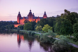 Johannisburg Palace and parklands along the Main river at dusk, Aschaffenburg, Franconia, Bavaria, Germany