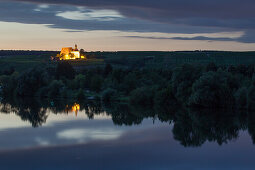 Reflection of Maria im Weingarten pilgrimage church in the Main river at dusk, Volkach, Franconia, Bavaria, Germany