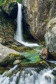 Waterfall cascading over boulders, Natural Park Mont Avic, Graian Alps range, valley of Aosta, Aosta, Italy