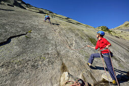 Two people climbing a rock face, Azalee Beach, Grimsel pass, Bernese Oberland, Switzerland