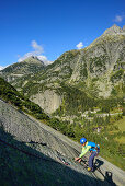 Woman climbing on granite slab, Sector Crow, Grimsel pass, Bernese Oberland, Switzerland