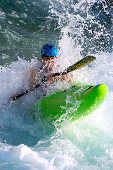 Paddler turning through waves, Al-Ain, Dubai, UAE