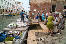 bags of vegetables, orders from Sant'Erasmo Island, delivery by boat, customers collect their plastic bags, residents, Venice, lagoon, Italy