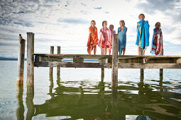 Children wrapped in towels on a jetty, lake Starnberg, Upper Bavaria, Bavaria, Germany
