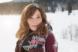 Young woman smiling at camera, Spitzingsee, Upper Bavaria, Germany