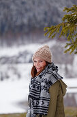 Young woman smiling at camera, Spitzingsee, Upper Bavaria, Germany