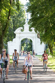 Cyclists near Adlertor, entrance to Keesscher Park, Markkleeberg, Saxony, Germany