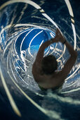 child sliding down a modern slide, Blaustein, Swabian Alb, Baden-Wuerttemberg, Germany