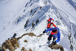 Three persons ascending on ridge towards Kleiner Kaserer, Kleiner Kaserer, valley of Schmirn, Zillertal Alps, Tyrol, Austria