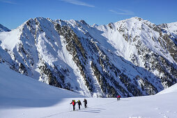 Several persons back-country skiing ascending towards Frauenwand, Frauenwand, valley of Schmirn, Zillertal Alps, Tyrol, Austria