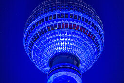 Colourfully illuminated TV tower Alex at night, Berlin Alexanderplatz, Berlin, Germany