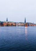 view over the Binnenalster to Jungfernstieg at dusk at Christmas, Hamburg, Germany