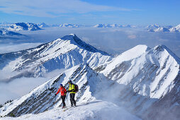 Two persons back-country skiing, Reifelberge in background, Sonntagshorn, Chiemgau range, Salzburg, Austria