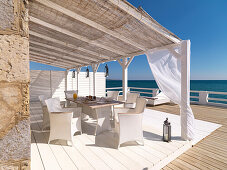 Terrace by the sea with table and chairs, Mallorca, Balearic Islands, Spain