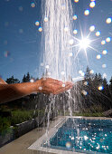 Hands under an outdoor shower, Ehrwald, Tyrol, Austria