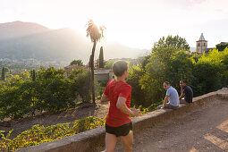 view over the valley of Soller, jogger, back light, romantic mountain village, Biniaraix, Serra de Tramuntana, Majorca, Balearic Islands, Spain, Europe