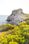 Coastal landscape and bay, Calo des Moro, tourists, Mediterranean Sea, near Santanyi, Majorca, Balearic Islands, Spain, Europe