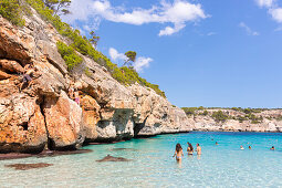 tourists in the water, bay with turquoise blue sea, near Calo des Moro, Mediterranean Sea, near Santanyi, Majorca, Balearic Islands, Spain, Europe