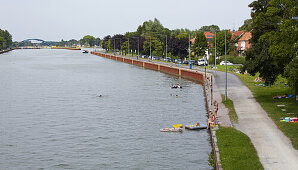 Ship and swimming near Lock Muenster in  the Dortmund-Ems-Kanal ,  Muensterland , North Rhine-Westphalia , Germany , Europe